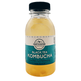 Craft & Culture's Apple Pie Black Tea Kombucha features a teal label with white text displaying the name and 250 ml (8.45 fl oz) volume. Infused with probiotics, it has a light amber hue.